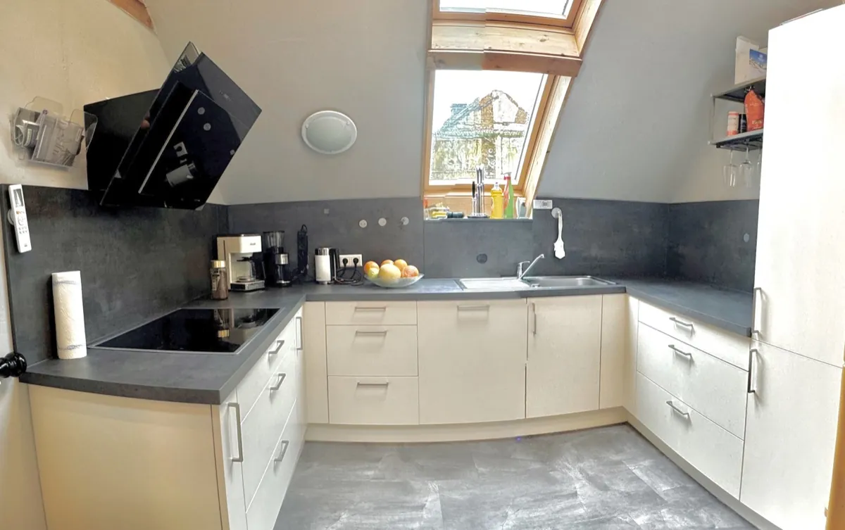 Kitchen after renovation – fully fitted kitchen under the roof beams