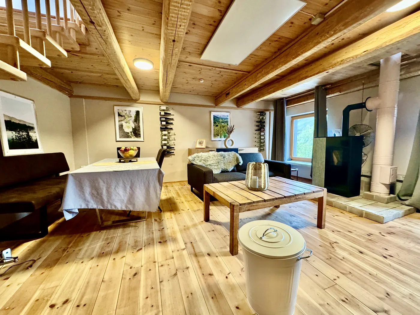 Living room with dining table and pellet stove